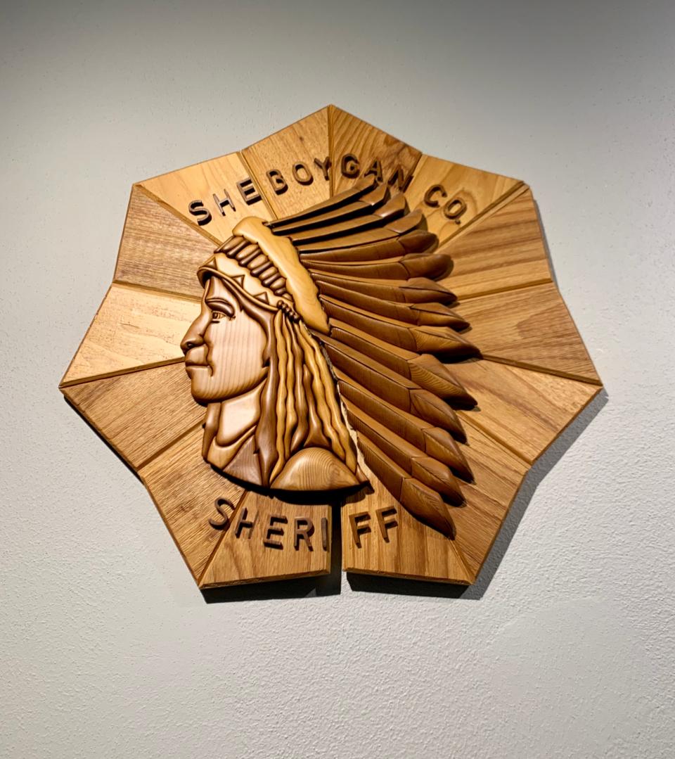 This wooden sign hangs in the front office of the Sheboygan County Sheriff's Department.