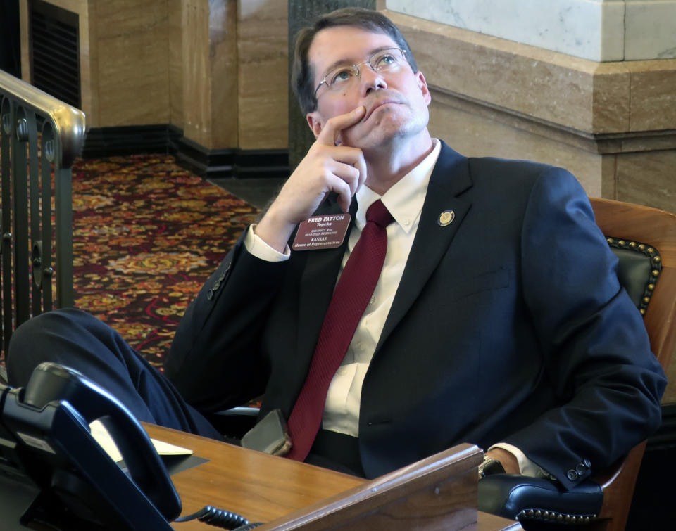 Kansas state Rep. Fred Patton, R-Topeka, watches an electronic tally board in the House as it approves a bill containing Democratic Gov. Laura Kelly's school funding plan, Thursday, April 4, 2019, at the Statehouse in Topeka, Kansas. Patton supports the measure. (AP Photo/John Hanna)