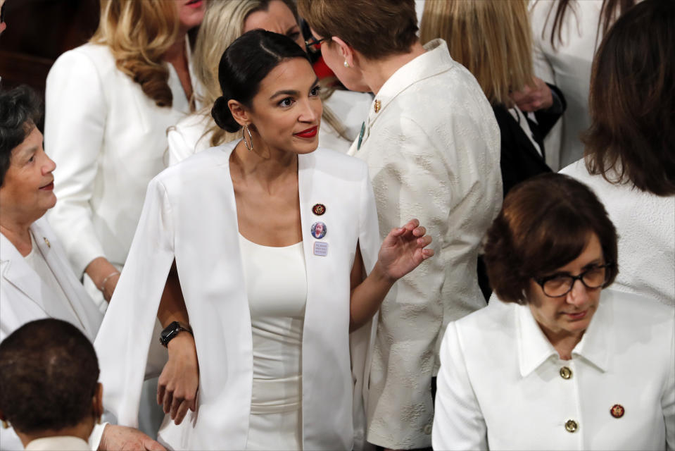 Democratic members of Congress, including Rep. Alexandria Ocasio-Cortez, D-N.Y., center, arrive before President Donald Trump delivers his State of the Union address to a joint session of Congress on Capitol Hill in Washington, Tuesday, Feb. 5, 2019. (AP Photo/J. Scott Applewhite)