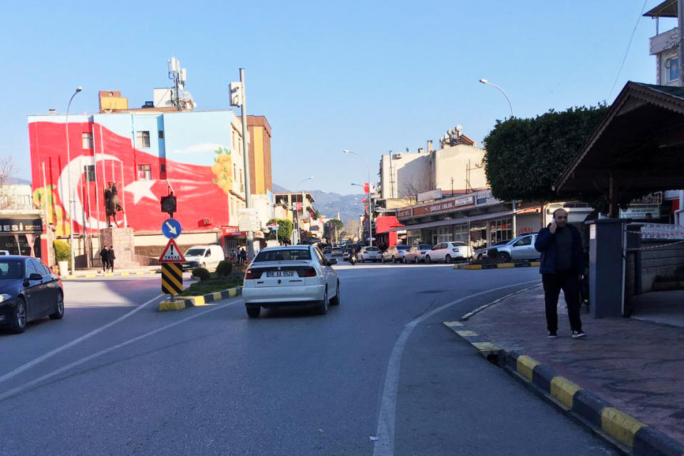 Erzin's streets have remained busy, like this intersection in the city's center Tuesday.  (Kristina Jovanovski)