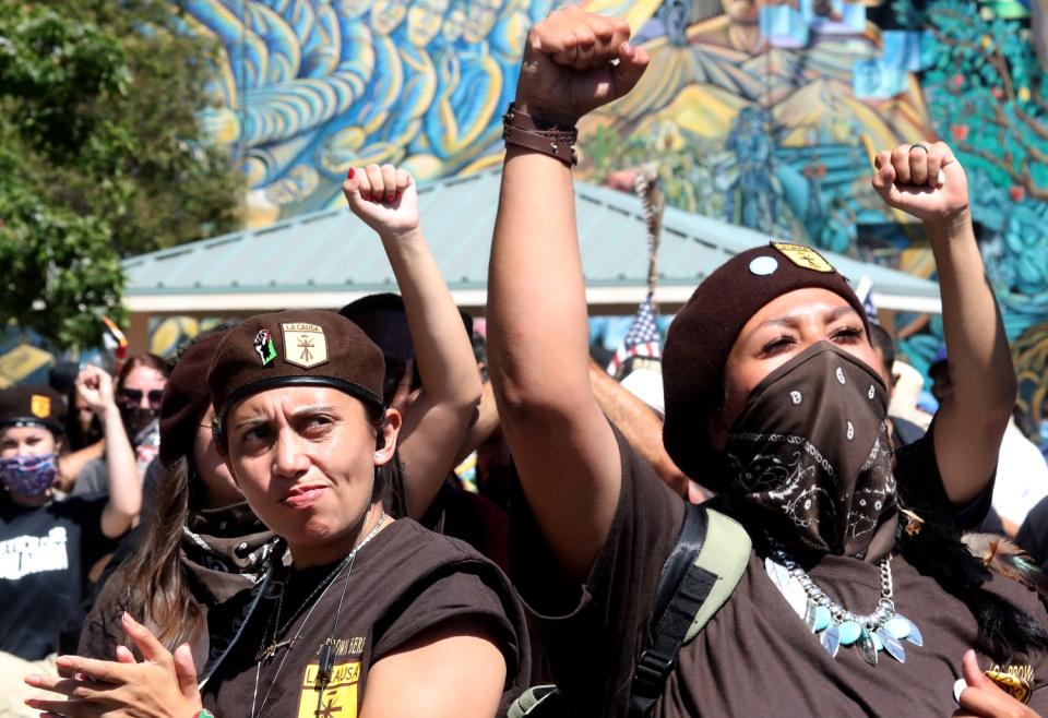 Brown Berets join hundreds of people gathered at Ruben Salazar Park in Los Angeles /