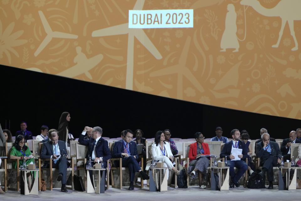 Delegates arrive for a meeting at the COP28 U.N. Climate Summit, Sunday, Dec. 10, 2023, in Dubai, United Arab Emirates. (AP Photo/Peter Dejong)