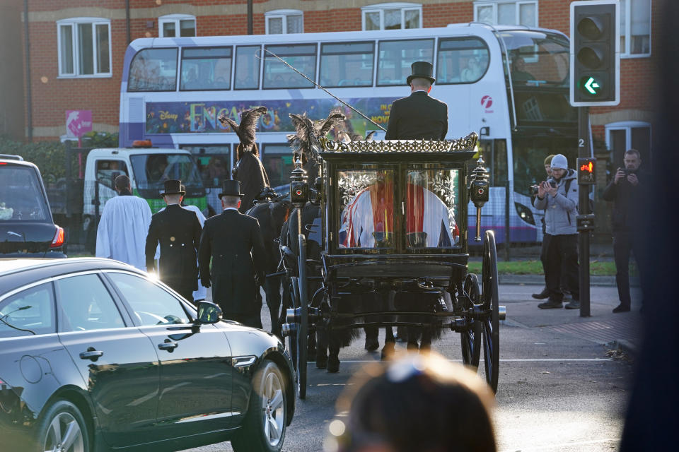 The horse drawn funeral hearse carrying the coffin of Sir David Amess leaves St Mary's Church in Prittlewell, Southend following his funeral service. Picture date: Monday November 22, 2021.