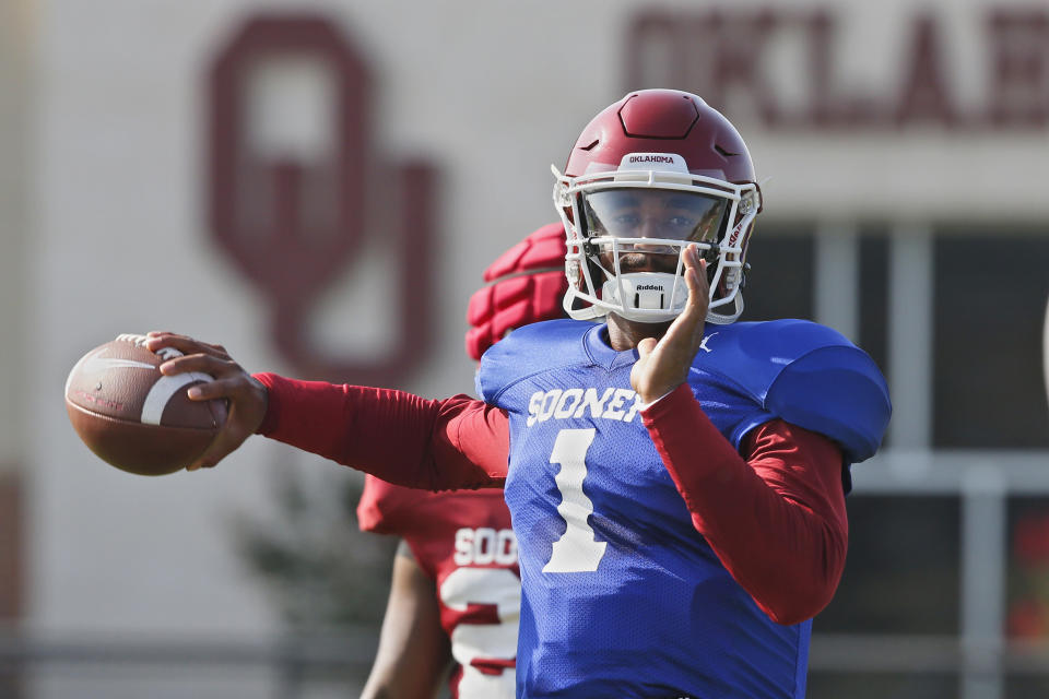 FILE - In this Monday, Aug. 5, 2019, file photo, Oklahoma quarterback Jalen Hurts throws during the NCAA college football team's practice in Norman, Okla. Oklahoma coach Lincoln Riley has chosen Hurts as his starting quarterback for the Sept. 1 season opener against Houston over Spencer Rattler and Tanner Mordecai. (AP Photo/Sue Ogrocki, File)