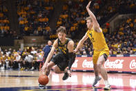 Baylor guard Matthew Mayer (24) drives to the net while being guarded by West Virginia guard Sean McNeil (22) during the second half of an NCAA college basketball game in Morgantown, W.Va., Tuesday, Jan. 18, 2022. (William Wotring)