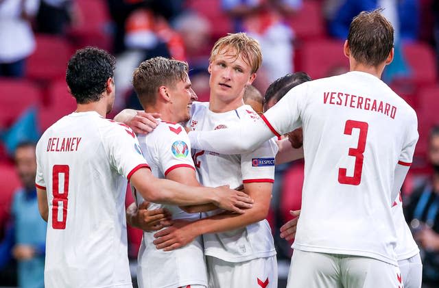 Kasper Dolberg (centre) helped send Denmark through 