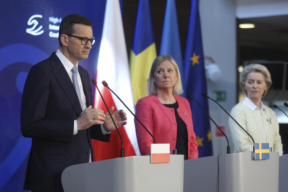 Polish Prime Minister, Mateusz Morawiecki, left, Prime Minister of Sweden, Magdalena Andersson and President of the European Commission, center, and Ursula von der Leyen, right, attend the press conference after the High-Level International Donor's Conference for Ukraine at the National Stadium in Warsaw, Poland, Thursday, May 5, 2022. The conference aims to raise funds for Ukraine's growing humanitarian needs. Poland and Sweden want to encourage their partners to jointly respond to the difficult humanitarian situation in Ukraine. (AP Photo/Michal Dyjuk)