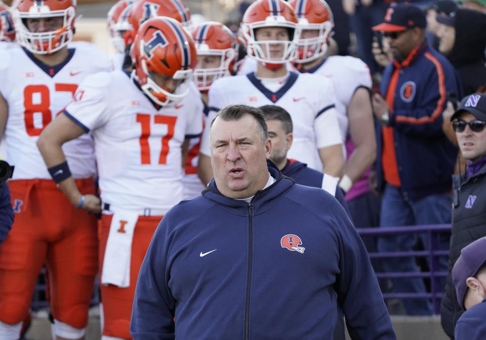 Nov. 26, 2022; Evanston; Illinois Fighting Illini head coach Bret Bielema leads his team on the field against the Northwestern Wildcats at Ryan Field. David Banks-USA TODAY Sports