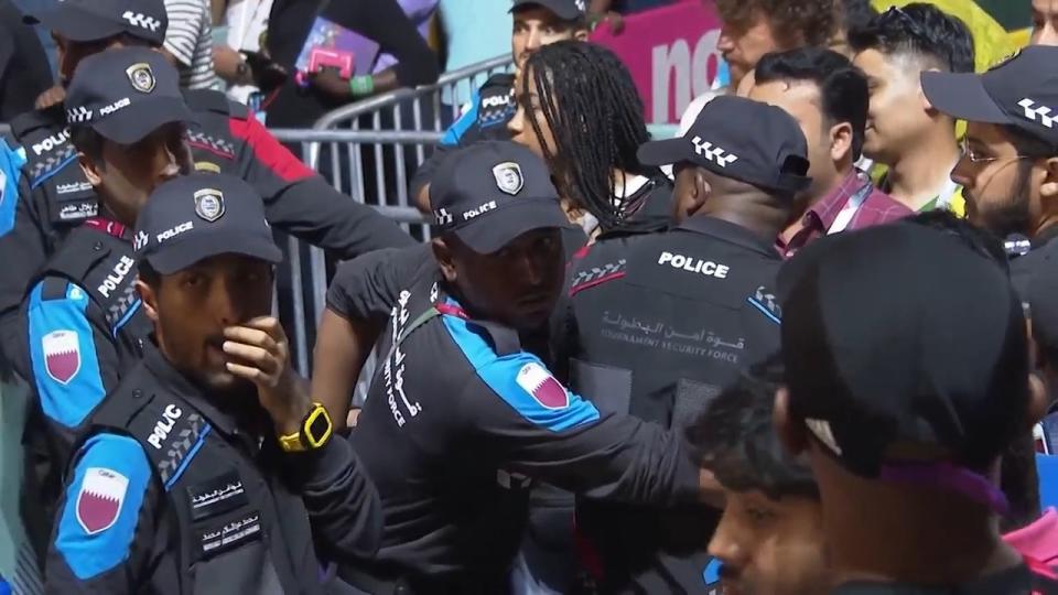 In this image from video, Qatari police try to control a crowd at a FIFA Fan Zone ahead of the World Cup in Doha, Qatar, Saturday, Nov. 19, 2022. Authorities turned away thousands of fans Saturday night from a concert celebrating the World Cup beginning the next day in Qatar, revealing the challenges ahead for Doha as it tries to manage crowds in FIFA's most-compact tournament ever. (AP Photo/Srdjan Nedeljkovic)