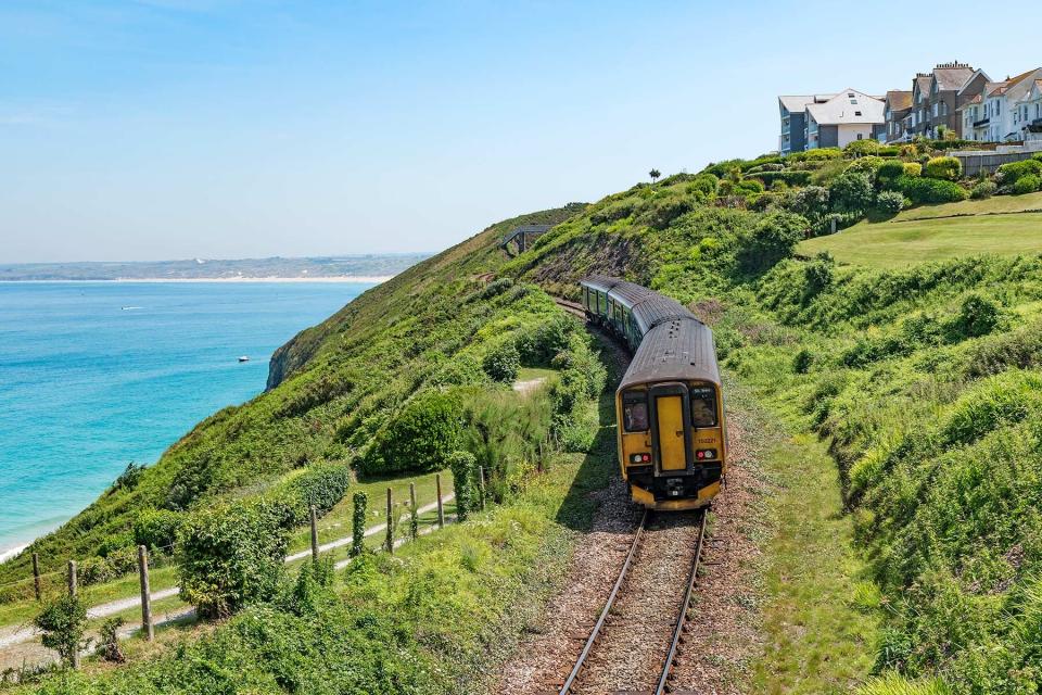 The St. Ives Branch Railway Line Passing Carbis Bay In Cornwall, England, Britain, UK