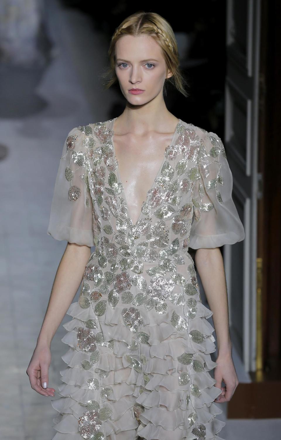 A model wears a creation by fashion designers Maria Grazia Chiuri and Pier Paolo Piccioli for Valentino as part of the Women's Spring/Summer 2013 Haute Couture fashion collection presented in Paris, Wednesday, Jan. 23 2013 (AP Photo/ Jacques Brinon)