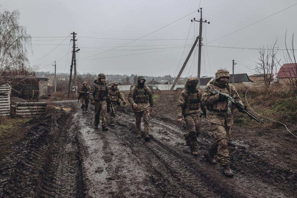 Ukrainian soldiers walk to the frontline in Bakhmut, Ukraine on December 16, 2022.