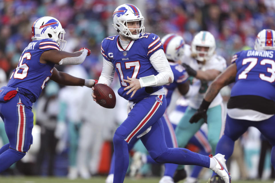 Buffalo Bills quarterback Josh Allen (17) runs a play during the second half of an NFL wild-card playoff football game against the Miami Dolphins, Sunday, Jan. 15, 2023, in Orchard Park, N.Y. (AP Photo/Joshua Bessex)