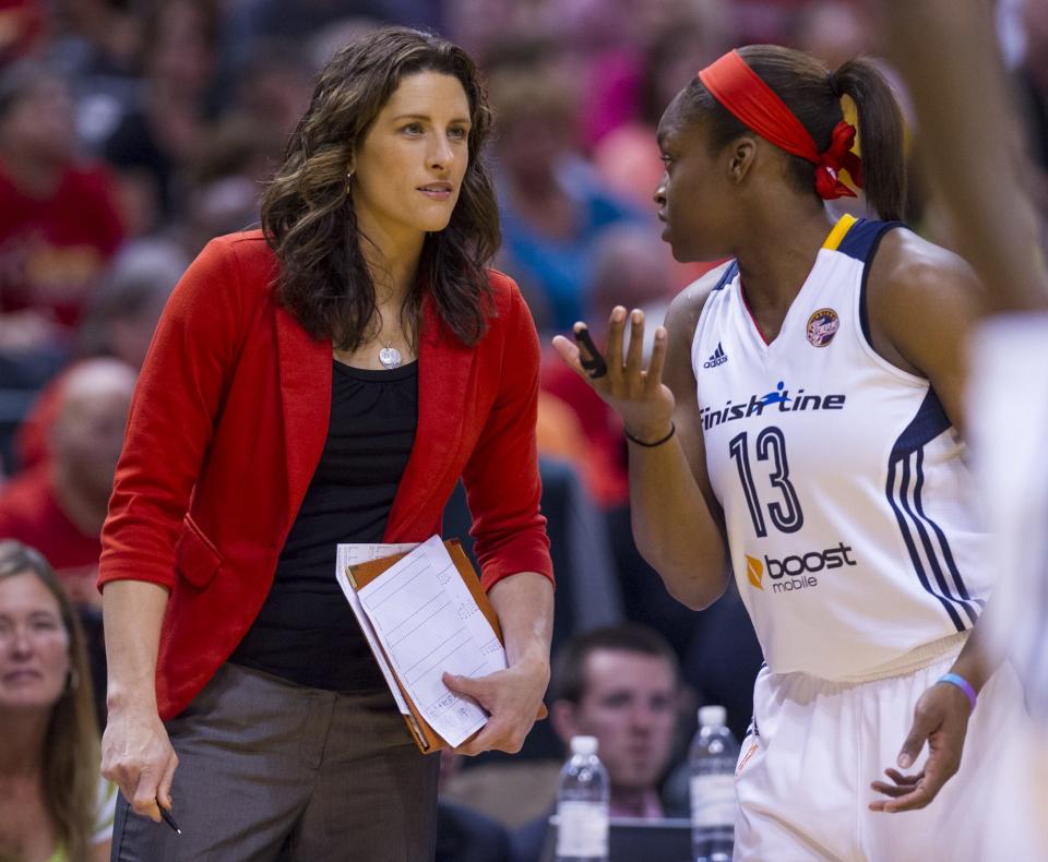 FILE -- Fever coach Stephanie White (then an assistant), talks with Karima Christmas during a break, July 12, 2014, at Bankers Life Fieldhouse.