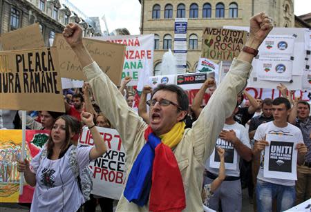 Protesters shout slogans during a demonstration against the opening of the Rosia Montana open cast gold mine in Bucharest September 1, 2013. REUTERS/Radu Sigheti