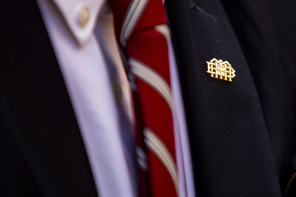 A graduate wears an MBA pin during Montgomery Bell Academy's graduation ceremony on MBA's campus in Nashville on Thursday, May 30, 2019.