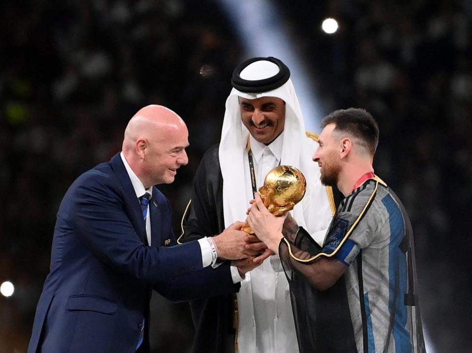 Lionel Messi of Argentina is awarded the World Cup by Fifa president Gianni Infantino (Getty Images)