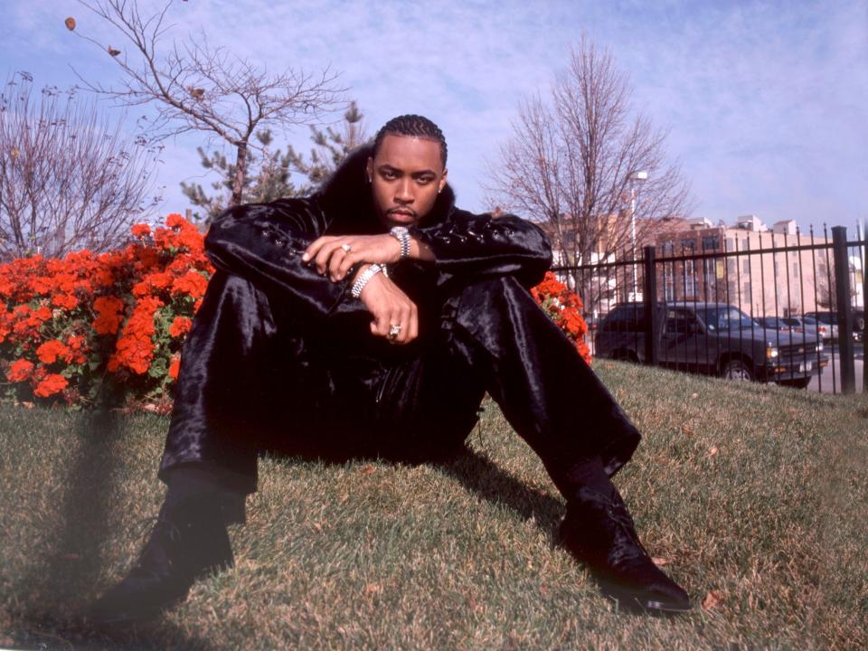 A portrait of musician Montell Jordan as he poses outdoors