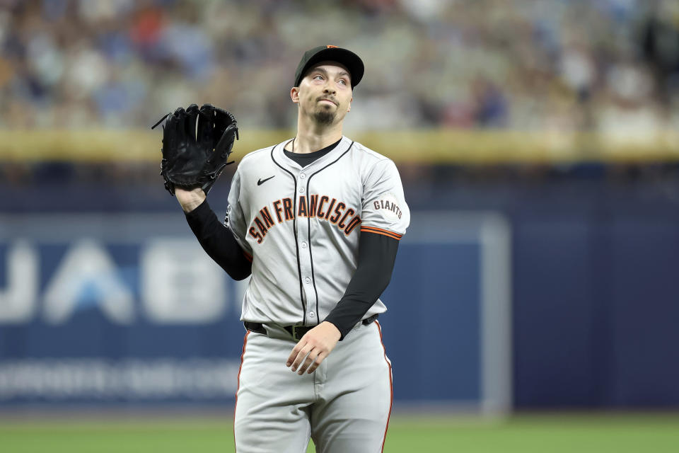 San Francisco Giants starting pitcher Blake Snell reacts after throwing a ball against the Tampa Bay Rays during the first inning of a baseball game Sunday, April 14, 2024, in St. Petersburg, Fla. (AP Photo/Mike Carlson)