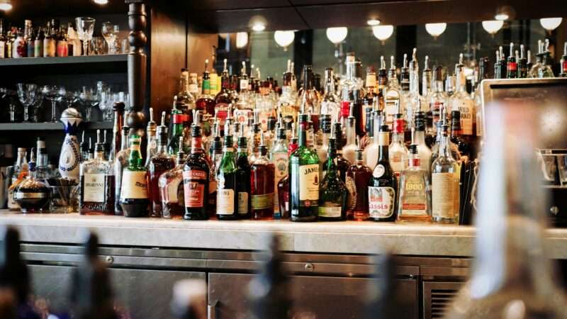 Liquor bottles behind a bar