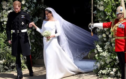 Prince Harry and Meghan Markle leave St George's Chapel - Credit: Andrew Matthews /PA