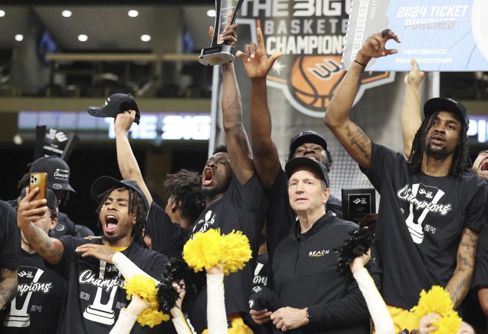 Long Beach State players cheer.