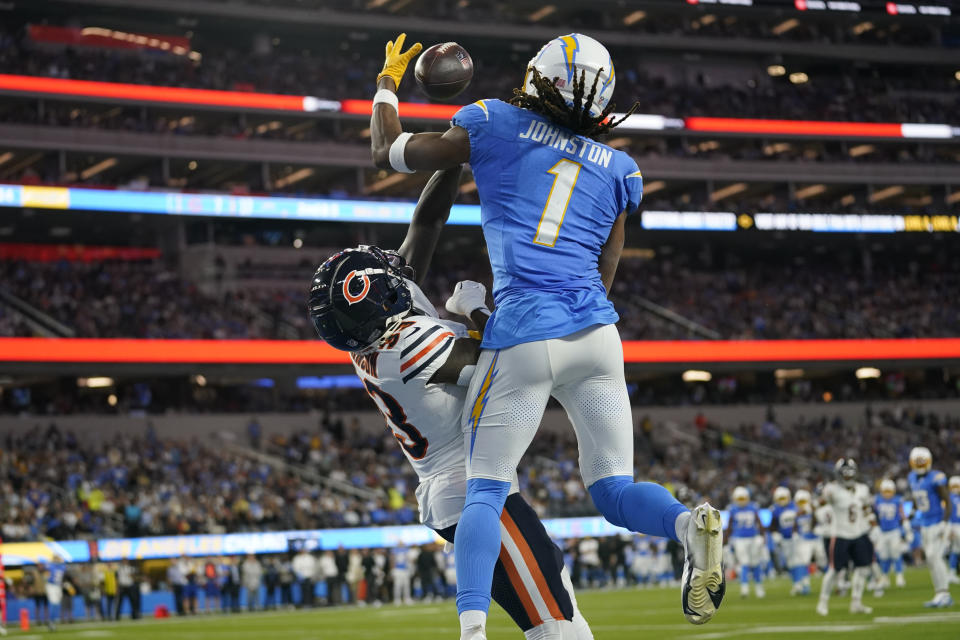 Chicago Bears cornerback Jaylon Johnson, left, breaks up a pass intended for Los Angeles Chargers wide receiver Quentin Johnston (1) during the first half of an NFL football game Sunday, Oct. 29, 2023, in Inglewood, Calif. (AP Photo/Ashley Landis)