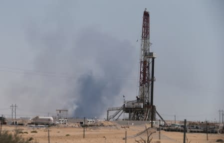 Smoke is seen following a fire at Aramco facility in the eastern city of Abqaiq