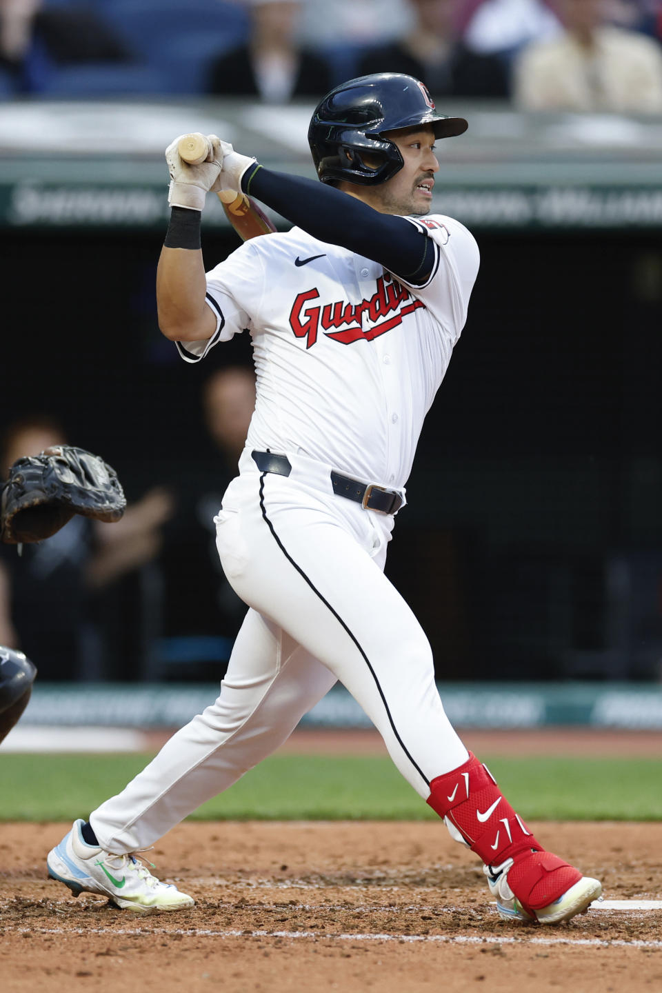 Cleveland Guardians' Steven Kwan watches his RBI single off Chicago White Sox pitcher Tim Hill during the fourth inning of a baseball game, Tuesday, April 9, 2024, in Cleveland. (AP Photo/Ron Schwane)