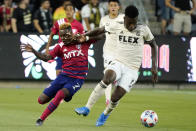 Los Angeles FC midfielder Jose Cifuentes, right, controls the ball next to Dallas FC forward Jader Obrian during the first half of an MLS soccer match Wednesday, June 23, 2021, in Los Angeles. (AP Photo/Marcio Jose Sanchez)