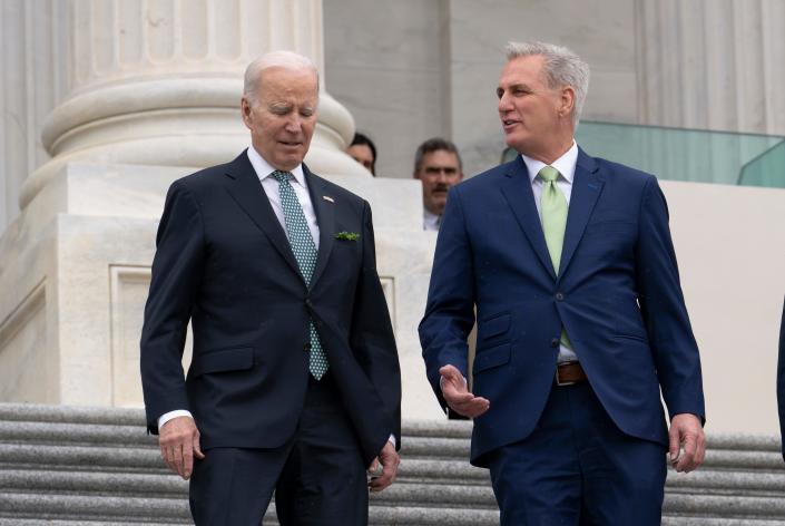 President Joe Biden walks with House Speaker Kevin McCarthy, R-Calif., as he departs the Capitol following the annual St. Patrick&#39;s Day gathering, in Washington, Friday, March 17, 2023. Facing the risk of a government default as soon as June 1, President Joe Biden invited the top four congressional leaders to a White House meeting for talks.