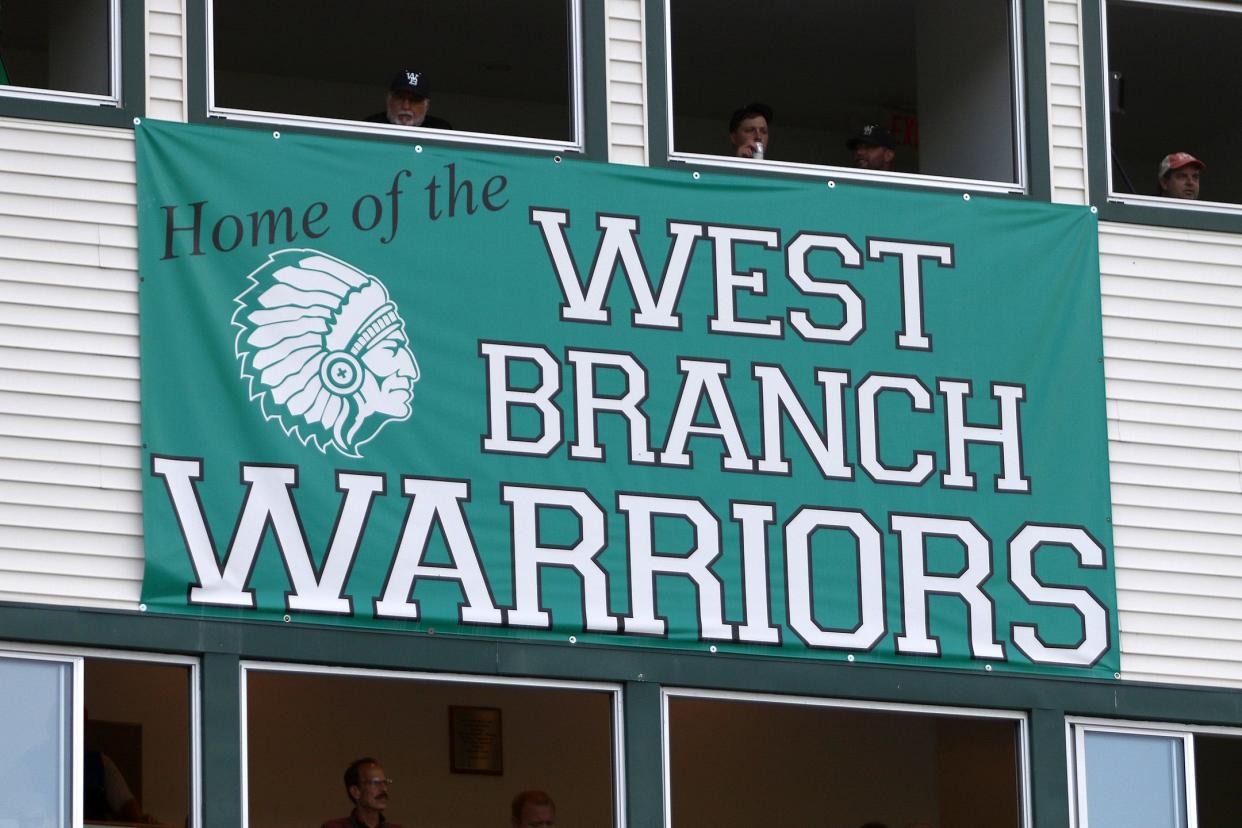 A banner hangs Sept. 3, 2021, on the press box at the West Branch football stadium.