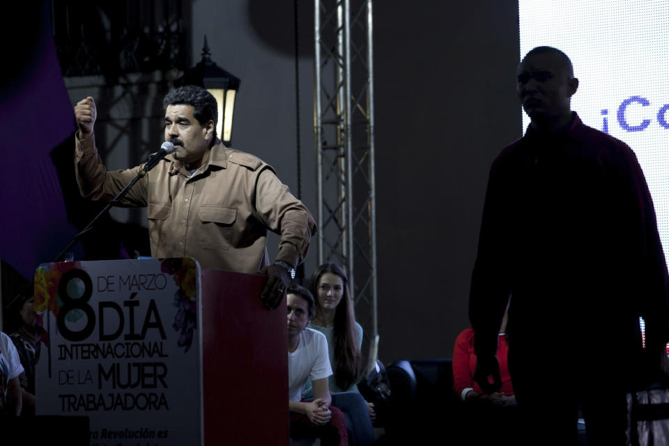 Venezuela's President Nicolas Maduro speaks at rally in Bolivar Square to commemorate International Women's Day in Caracas, Venezuela, Saturday, March 8, 2014. Maduro's government celebrated an Organization of American States declaration supporting its efforts to bring a solution to the country's worst political violence in years, calling it a diplomatic victory. The United States, Canada and Panama were the only nations to oppose the declaration. Meanwhile street protests continue almost daily while the opposition sits out a peace process it calls farcical. (AP Photo/Alejandro Cegarra)