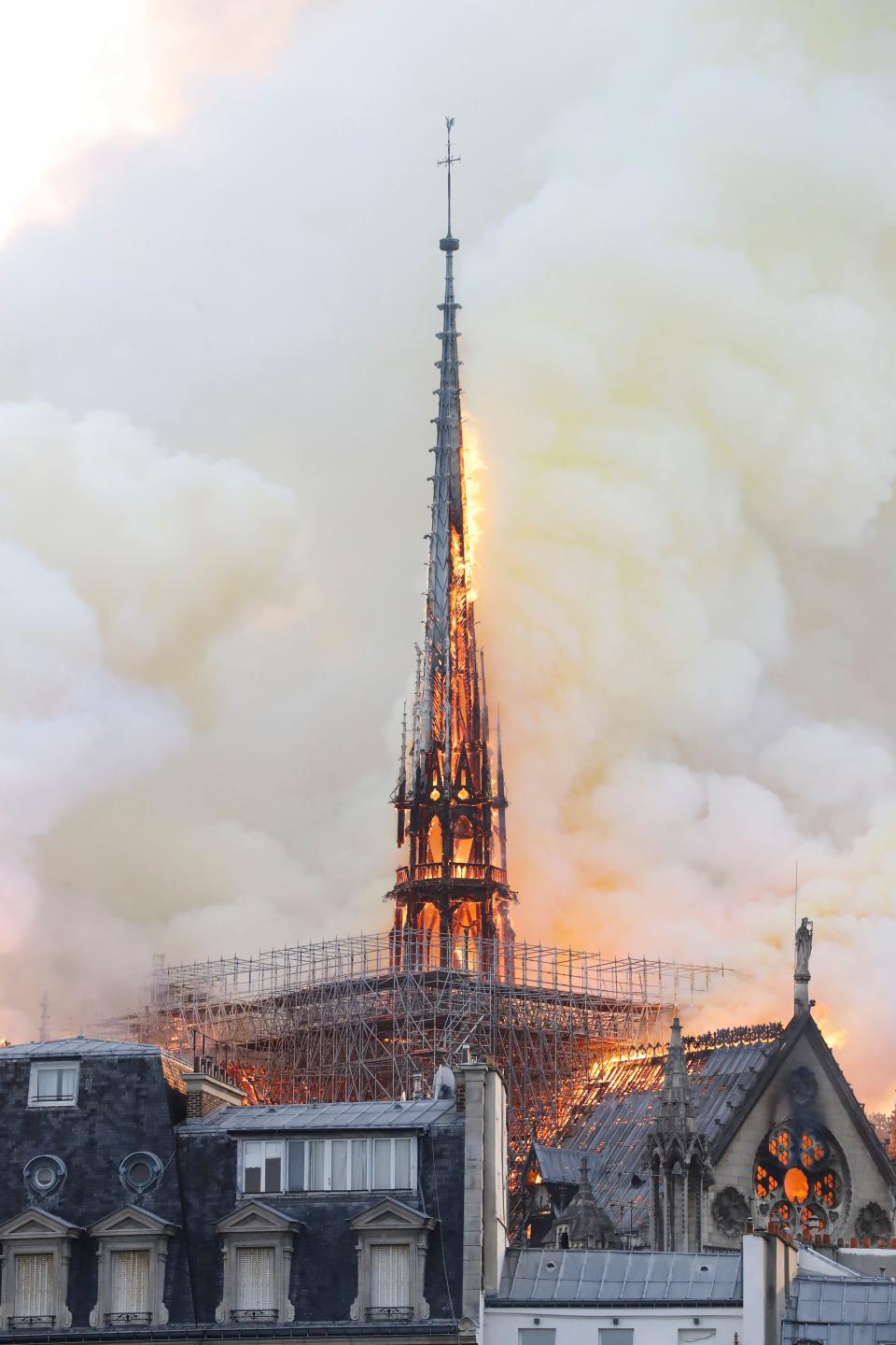 Smoke and flames rise during a fire at the landmark Notre-Dame Cathedral in central Paris on April 15, 2019, potentially involving renovation works being carried out at the site, the fire service said. (Photo: Francois Guillot/AFP/Getty Images)