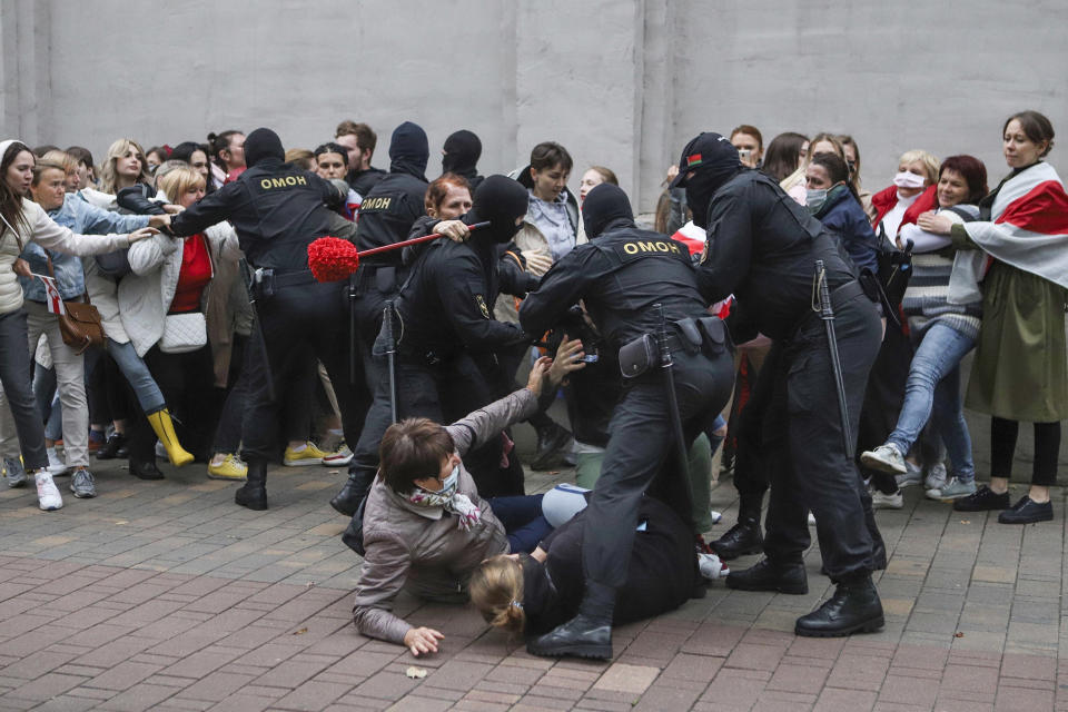Image: Police officers detain protesters during a rally in support of Maria Kolesnikova in Minsk, Belarus, (AP)
