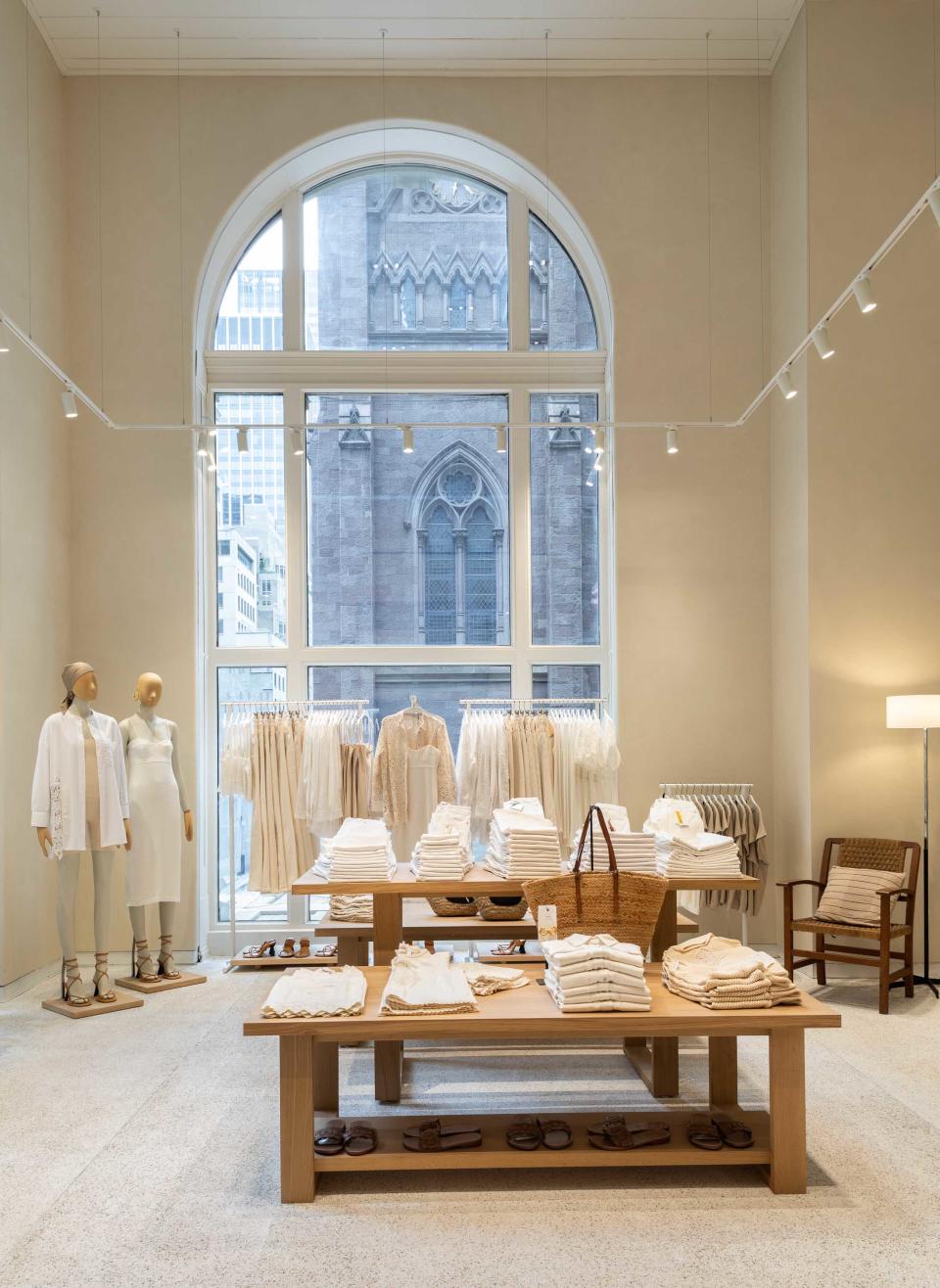 Inside Mango’s flagship, a shop with tall arched windows displays summery white sportswear. - Credit: Brett Beyer / Courtesy of Mango