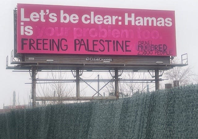 The vandalized sign on I-290 in Worcester.