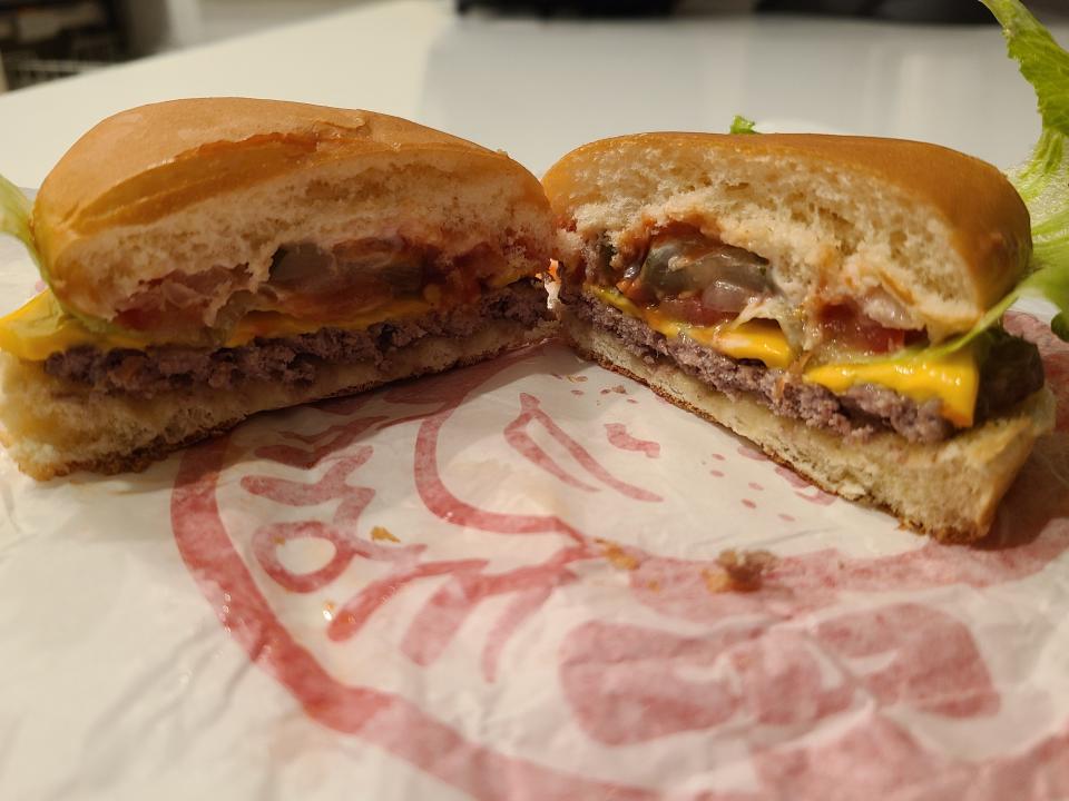 wendys jr cheeseburger deluxe on white and red wrapper