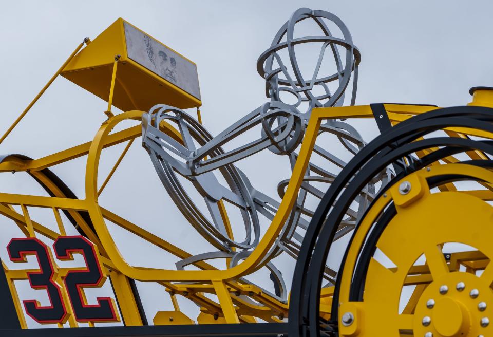 A sculpture of a Marmon Wasp, the winning car of the first running of the Indianapolis 500, on Friday, Feb. 17, 2023, in Carmel, Indiana. The car was named after its color and tail shape. The sculpture, created by artist Arlon Bayliss, of Anderson, sits at the roundabout at 96th Street and Priority Way.