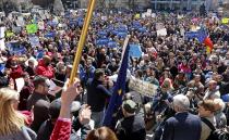 Demonstrators gather at Monument Circle to protest a controversial religious freedom bill recently signed by Governor Mike Pence, during a rally in Indianapolis March 28, 2015. More than 2,000 people gathered at the Indiana State Capital Saturday to protest Indiana's newly signed Religious Freedom Restoration Act saying it would promote discrimination against individuals based on sexual orientation. (REUTERS/Nate Chute)