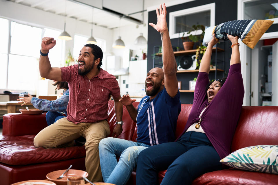 Sports fan getting excited in their home