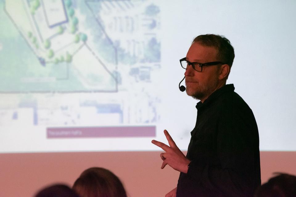 Chad Holtzinger, president of Shopworks Architecture, speaks during a neighborhood meeting Thursday at Northside Aztlan Center in Fort Collins.