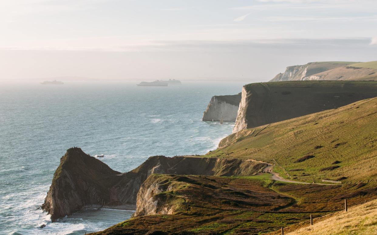 cruise ships in distance in dorset - Getty