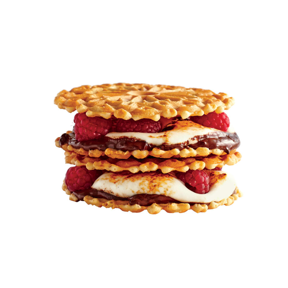 <p>Sandwich this colorful, fruity compilation with pizzelle waffle cookies to infuse an ice cream cone crunch into the warm, berry dessert.</p><strong>Recipe: <a rel="nofollow noopener" href="http://www.myrecipes.com/recipe/cabernet-raspberry-smores" target="_blank" data-ylk="slk:Cabernet Raspberry S’mores;elm:context_link;itc:0;sec:content-canvas" class="link ">Cabernet Raspberry S’mores</a></strong>