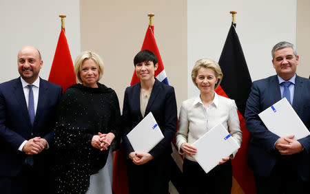 Luxembourg's Defence Minister Etienne Schneider, Dutch Defence Minister Jeanine Hennis-Plasschaert, Norway's Defence Minister Ine Marie Eriksen Soreide, German Defence Minister Ursula von der Leyen and Belgium's Defence Minister Steven Vandeput (L-R) pose after signing european military cooperation agreements at the Alliance headquarters in Brussels, Belgium February 16, 2017. REUTERS/Francois Lenoir