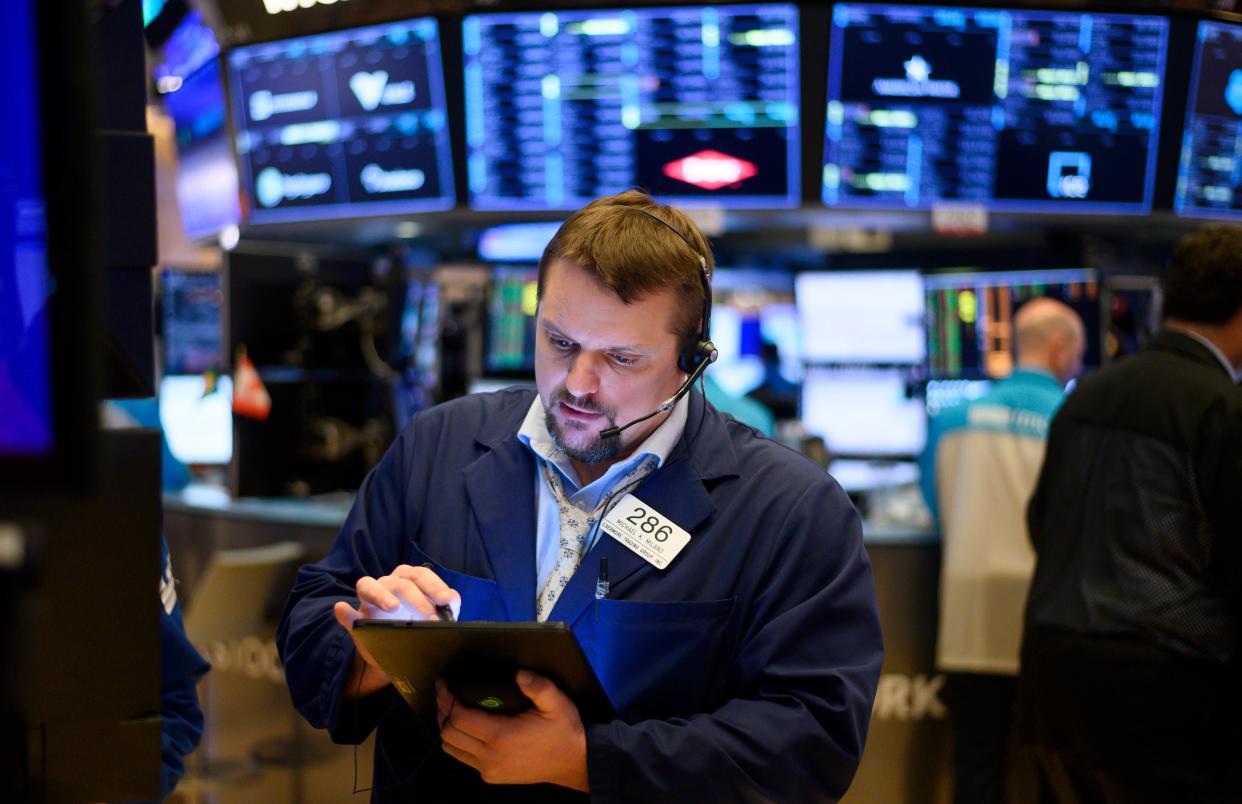 Traders work during the opening bell at the New York Stock Exchange (NYSE) on February 27, 2020 at Wall Street in New York City. - Wall Street stocks opened sharply lower Thursday, joining a sell-off in most global bourses on fears the coronavirus will grow into a significant international health crisis. About five minutes into trading, the Dow Jones Industrial Average was down 1.8 percent, or about 480 points. The blue-chip index has fallen the last five days. (Photo by Johannes EISELE / AFP) (Photo by JOHANNES EISELE/AFP via Getty Images)