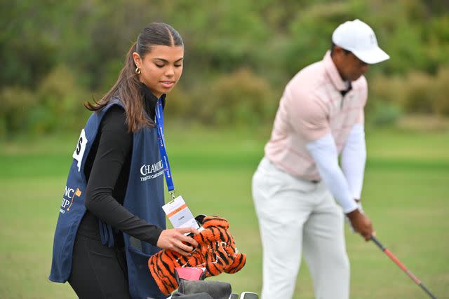 <p>Ben Jared/PGA TOUR via Getty </p> Sam Woods works as her dad's caddy on Dec. 16