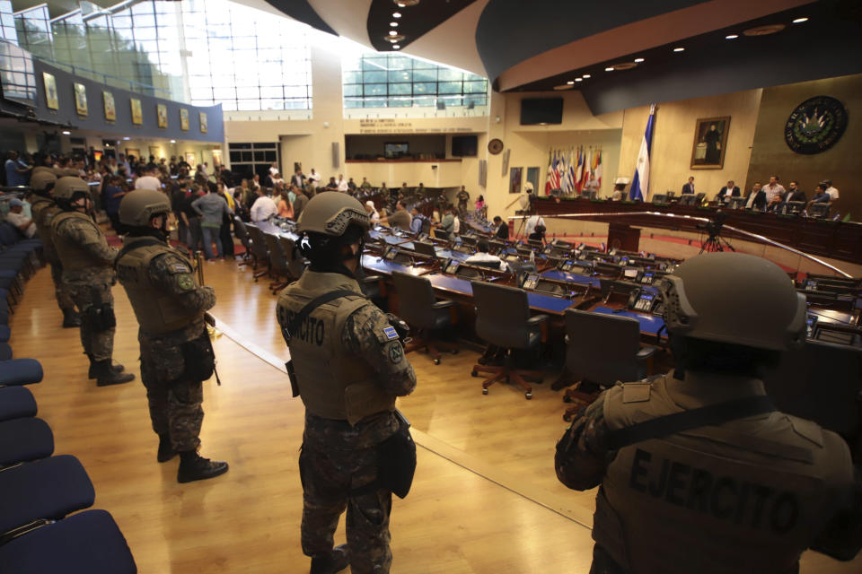 Armed Special Forces soldiers of the Salvadoran Army, following orders of President Nayib Bukele, enter congress upon the arrival of lawmakers, in San Salvador, El Salvador, Sunday, Feb. 9, 2020. Bukele has called on supporters to converge around the country's parliament after legislators refused to gather to vote on a $109 million loan to better equip the country's security forces. Top commanders of the country's police and military have expressed allegiance to the president during the standoff, while positioning security forces in and around the legislative building. (AP Photo/Salvador Melendez)