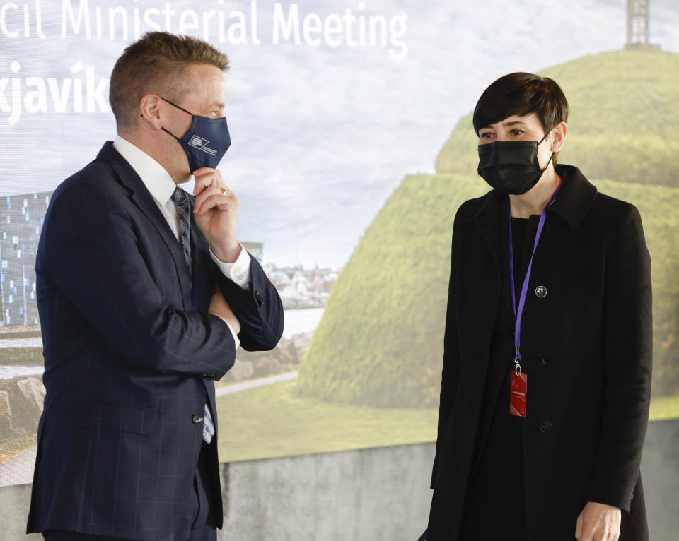 Norwegian Minister of Foreign Affairs Ine Marie Eriksen Søreide is greeted by Icelandic Minister of Foreign Affairs Gudlaugur Thor Thordarson as she arrives for the Arctic Council Ministerial Meeting in Reykjavik, Iceland, Thursday, May 20, 2021. (AP Photo/Brynjar Gunnarsson, Pool)