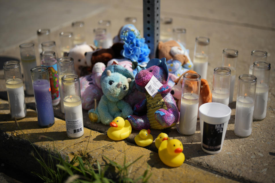 Mementos and candles are seen at a memorial for Dymir Stanton, 29, a victim of a fatal shooting spree, Thursday, July 6, 2023, in Philadelphia. The shooting left five people dead and four others wounded Monday night. (AP Photo/Matt Slocum)